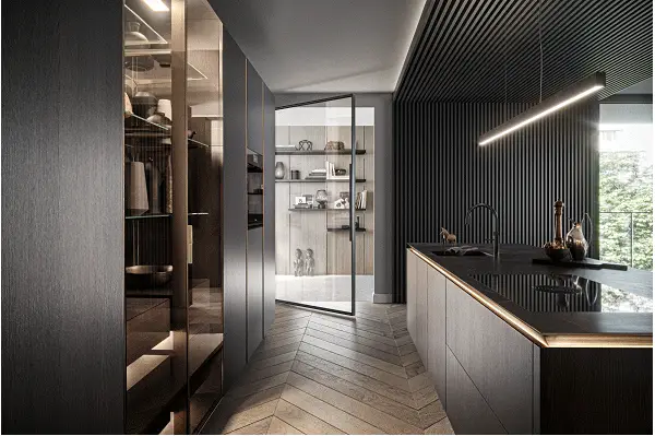 Modern luxury kitchen with custom dark cabinetry, sleek lines, and integrated lighting. Features herringbone wood flooring, a minimalist open shelving unit, and a central island with a contemporary faucet.