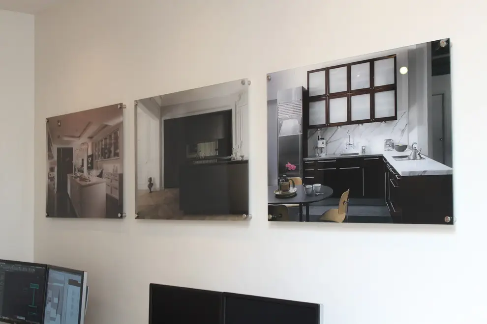 Display of modern kitchen designs featuring custom cabinetry on wall, showcasing elegant storage solutions.