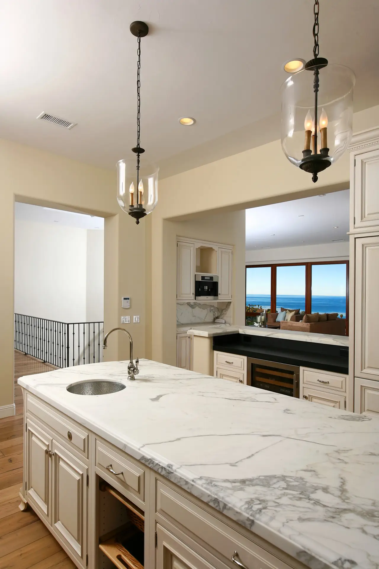 Modern luxury kitchen with custom cabinetry, elegant marble counterto