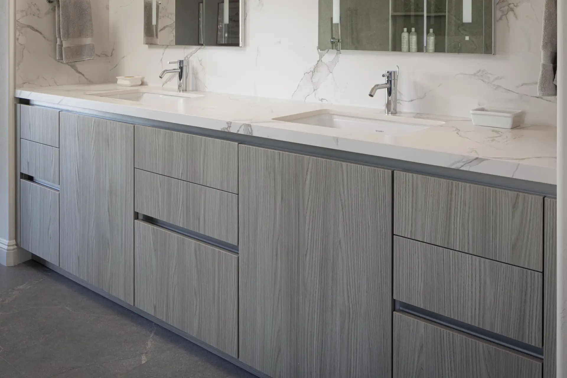 Handleless grey woodgrain vanity cabinetry detail, La Jolla bathroom by Inplace Studio