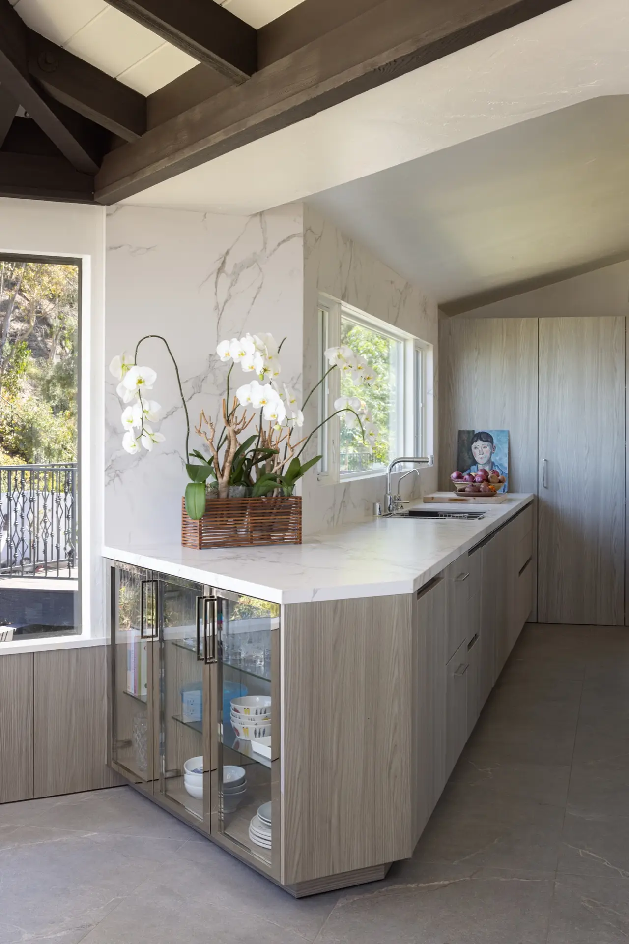 La Jolla kitchen with glass-front display cabinetry and Dekton countertop