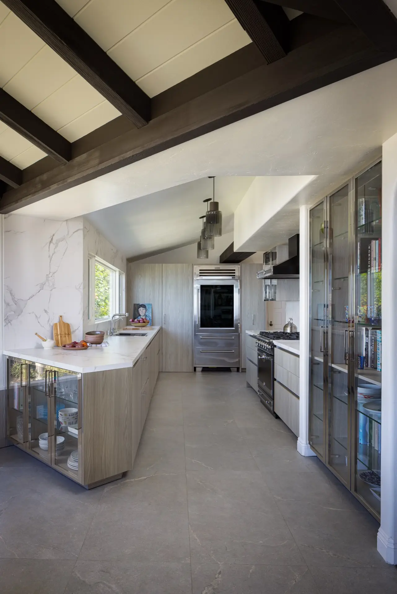 Modern La Jolla kitchen with vaulted beam ceiling and custom cabinetry by Inplace Studio