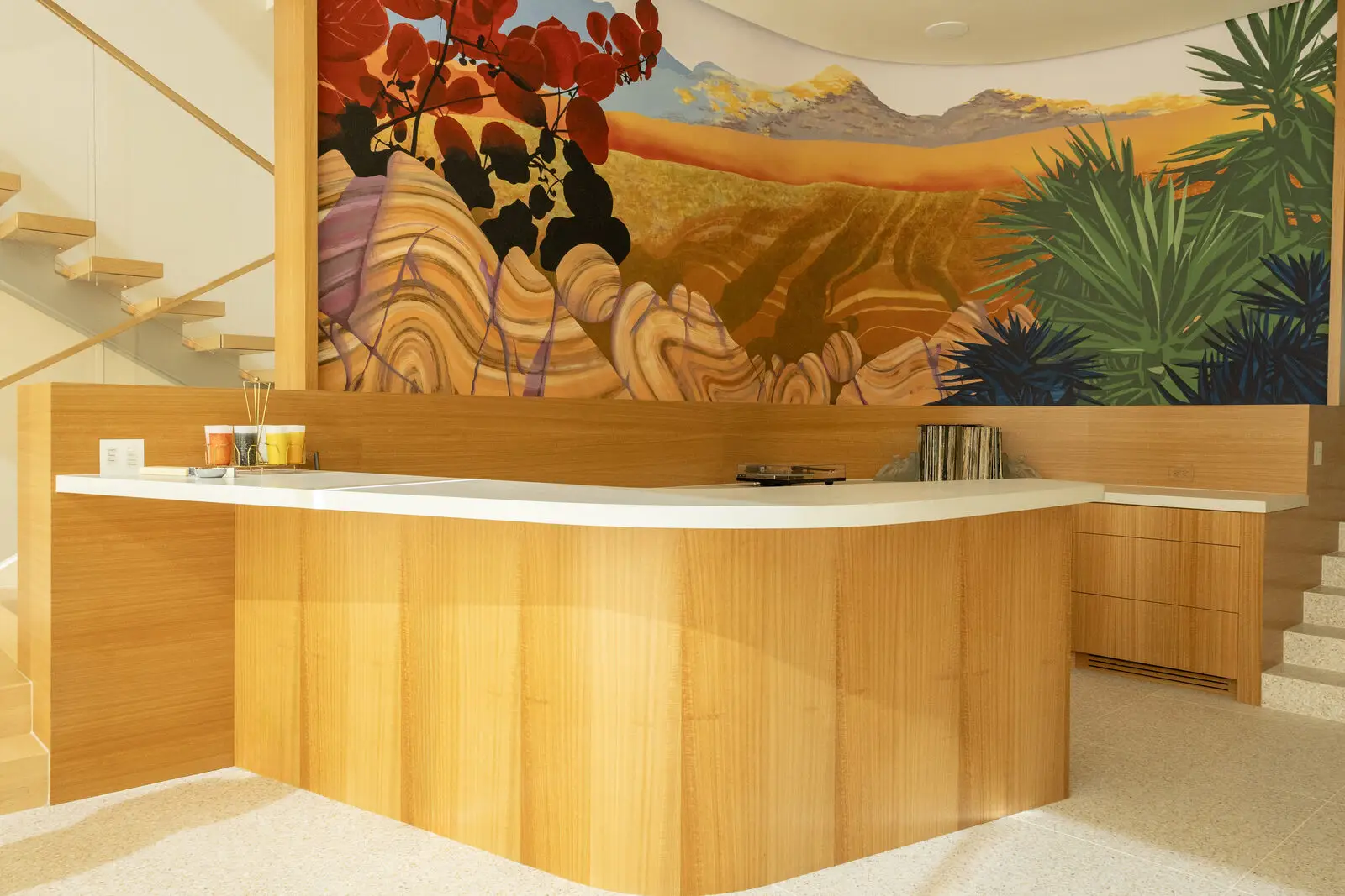 Eucalyptus veneer counter and cabinetry beside the staircase — San Diego custom cabinetry