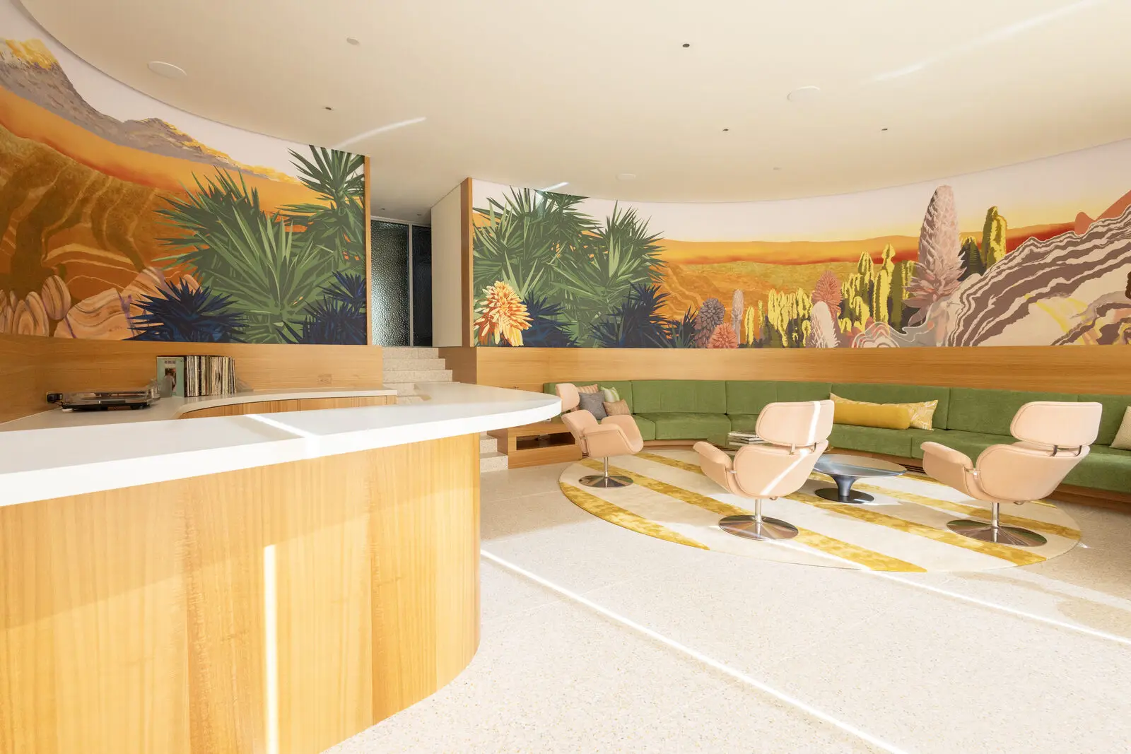 Curved eucalyptus veneer counter and custom cabinetry — San Diego
