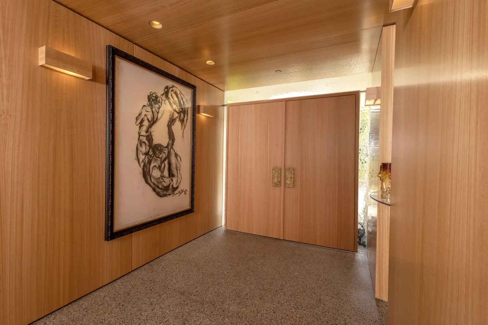 Custom eucalyptus veneer entry paneling and doors — San Diego custom cabinetry