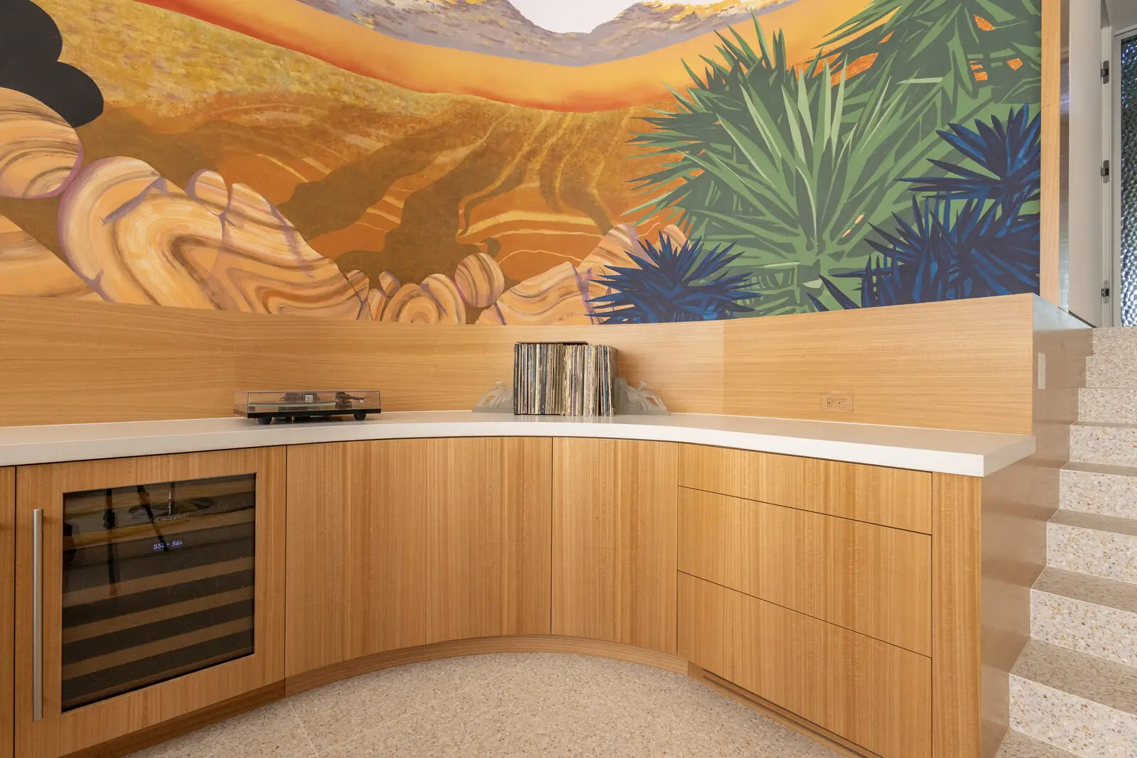 Eucalyptus veneer millwork with built-in lounge seating — San Diego custom cabinetry