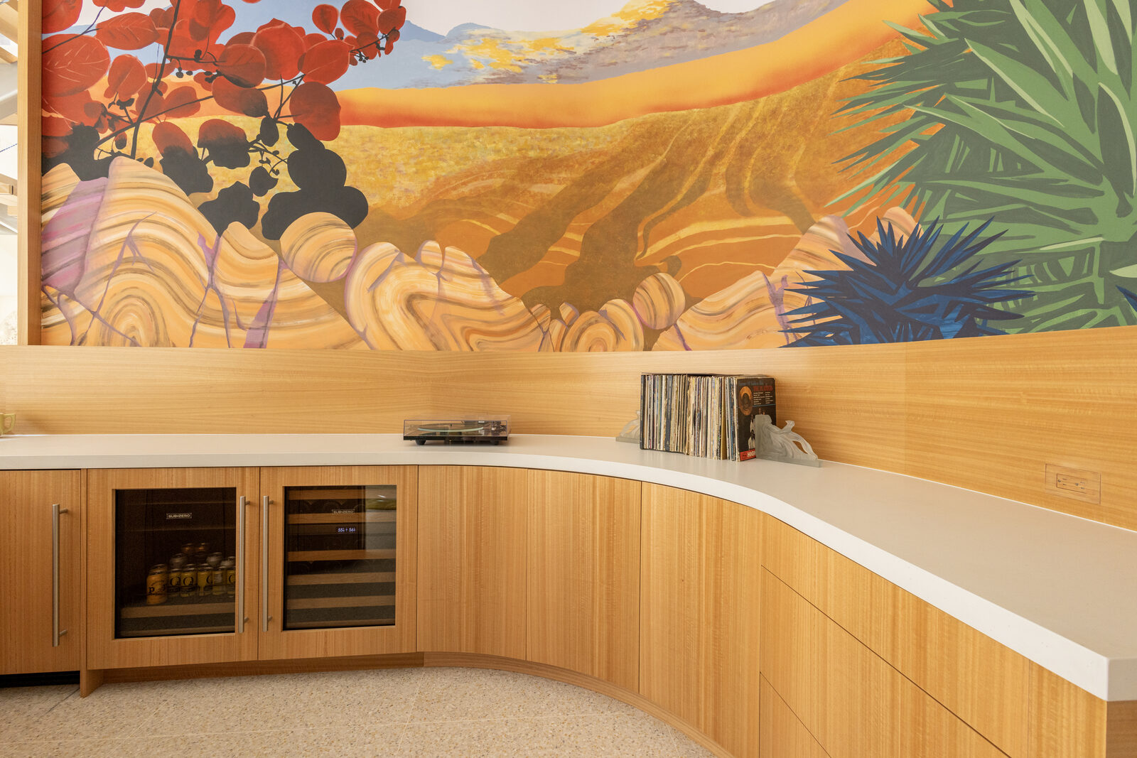 Curved eucalyptus veneer counter and custom cabinetry — San Diego