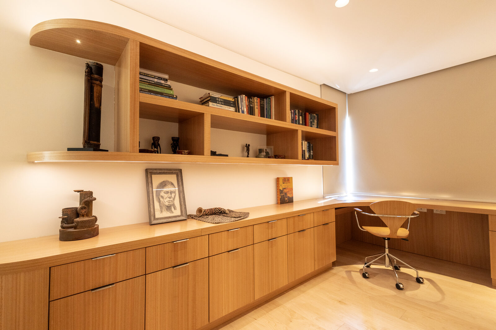 Floor-to-ceiling eucalyptus veneer paneling and custom cabinetry — San Diego