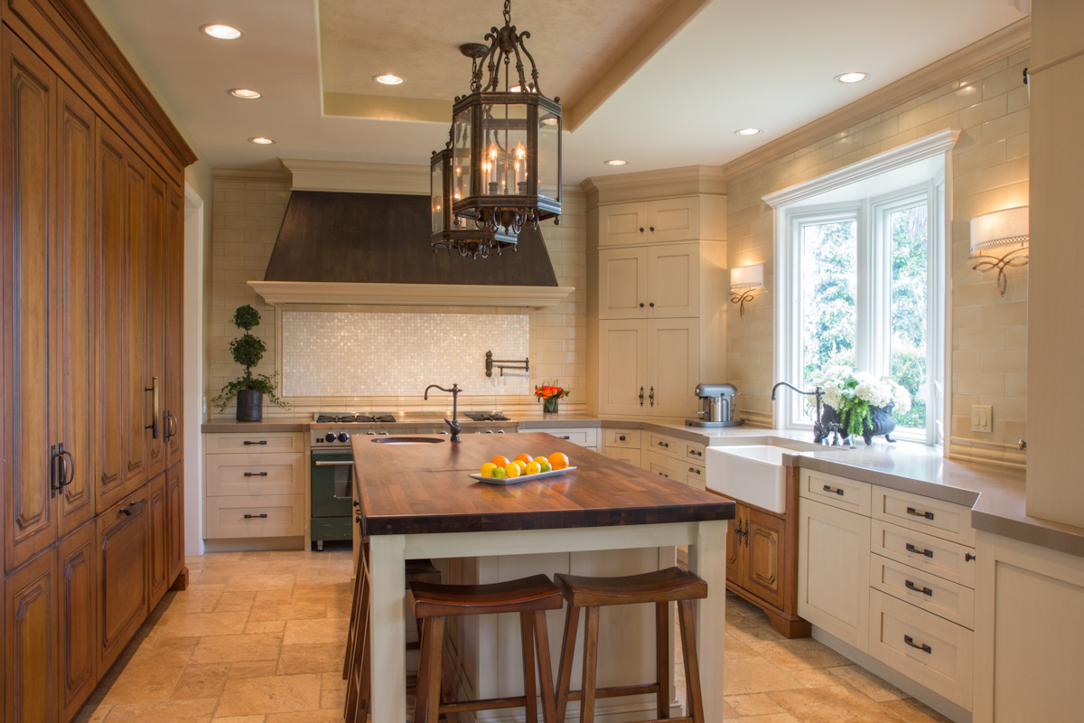 Elegant kitchen with custom cabinetry in Los Angeles, featuring luxurious wood finishes, spacious island with seating, and well-designed storage solutions.
