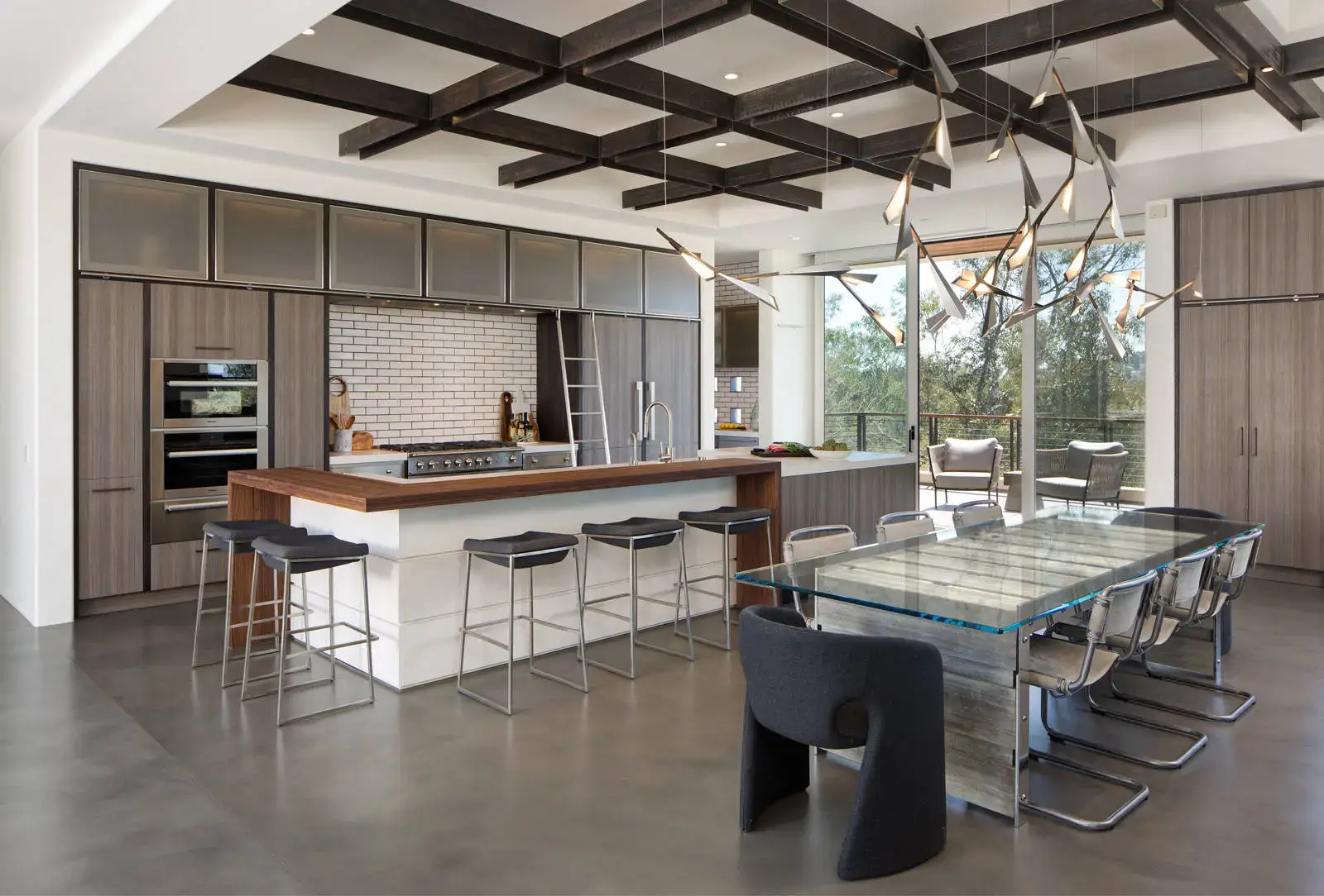 Modern European kitchen with luxurious cabinets, featuring a minimalist design with high-end finishes, sleek bar stools, a glass dining table, and contemporary lighting, offering an elegant and fun