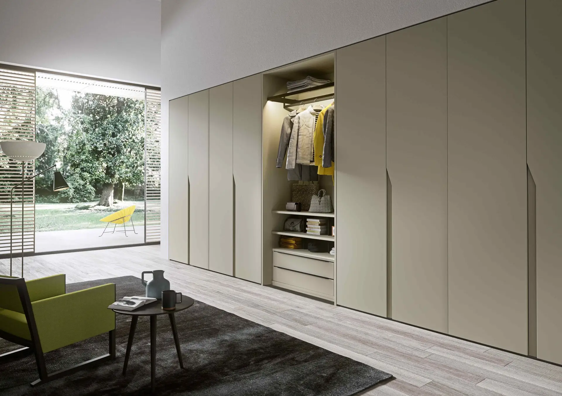 Wardrobe with fitted walnut interior and integrated lighting