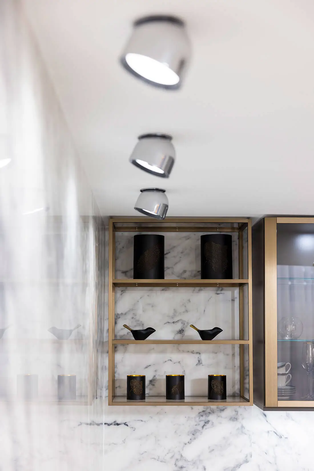 SieMatic CLASSIC brass shelf system on marble wall &mdash; detail