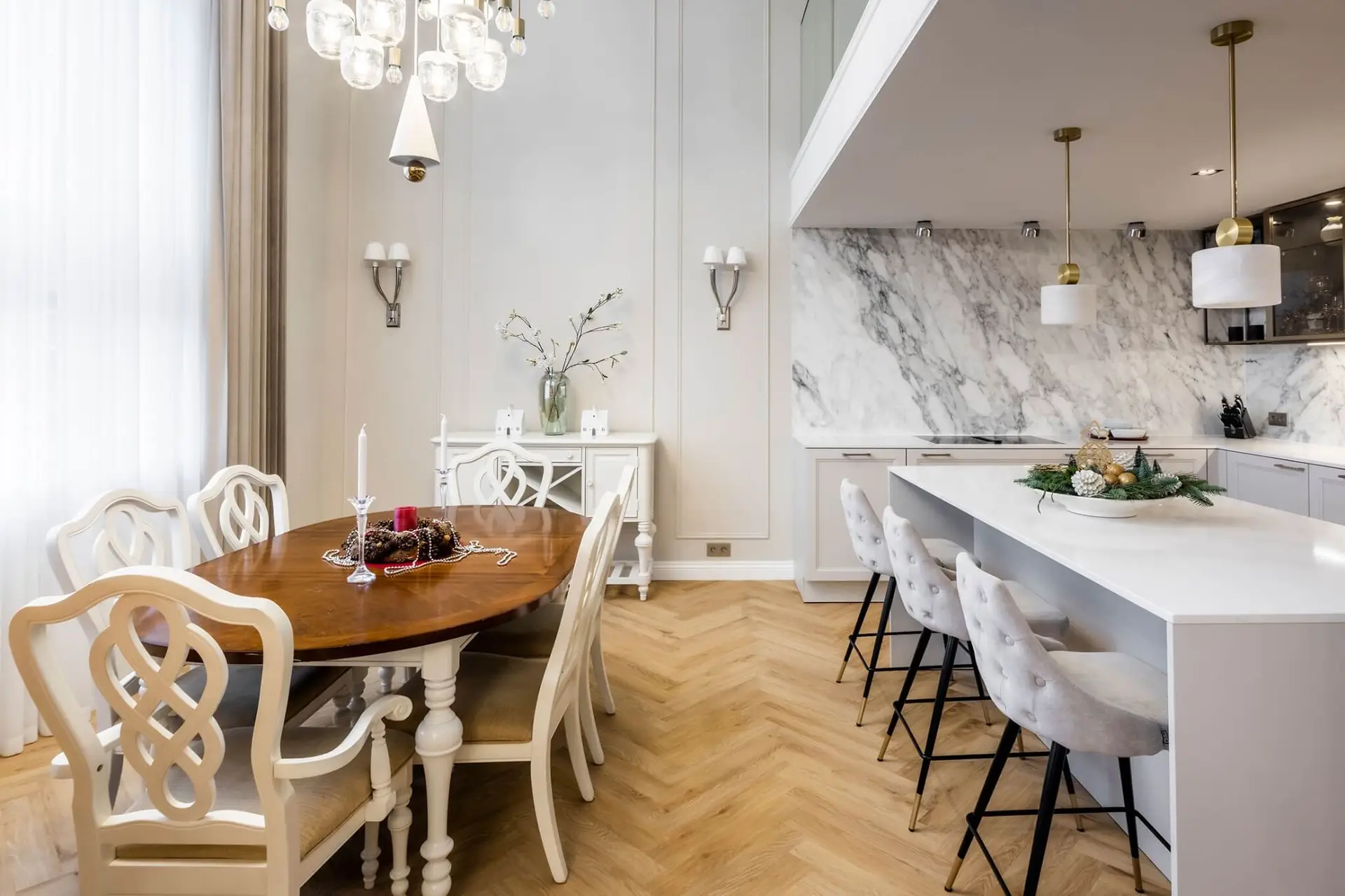 Classic open kitchen and dining room with marble wall and herringbone floor &mdash; SieMatic CLASSIC