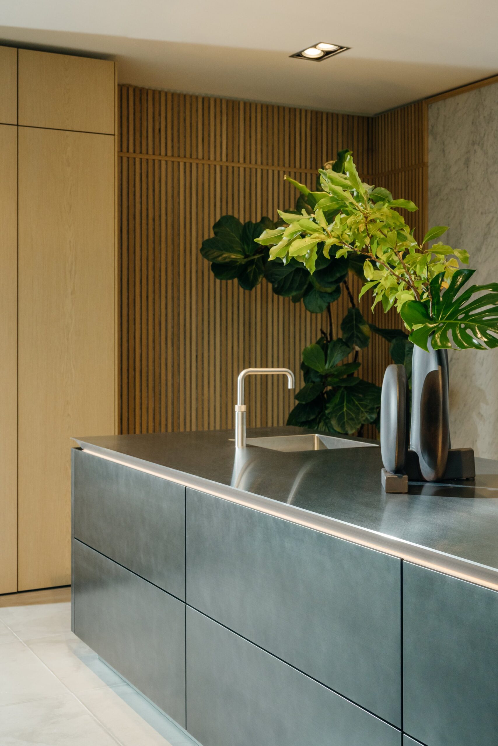 SieMatic Pure stainless steel island with natural oak slat wall