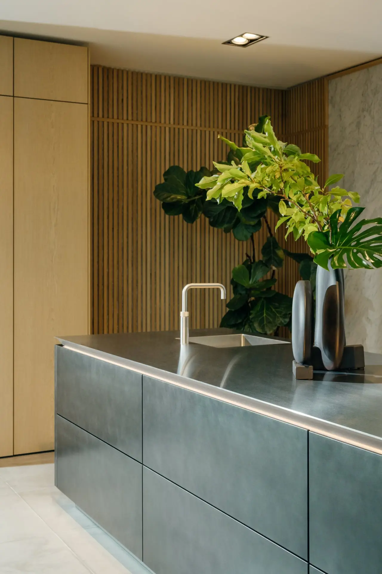 SieMatic Pure stainless steel island with natural oak slat wall