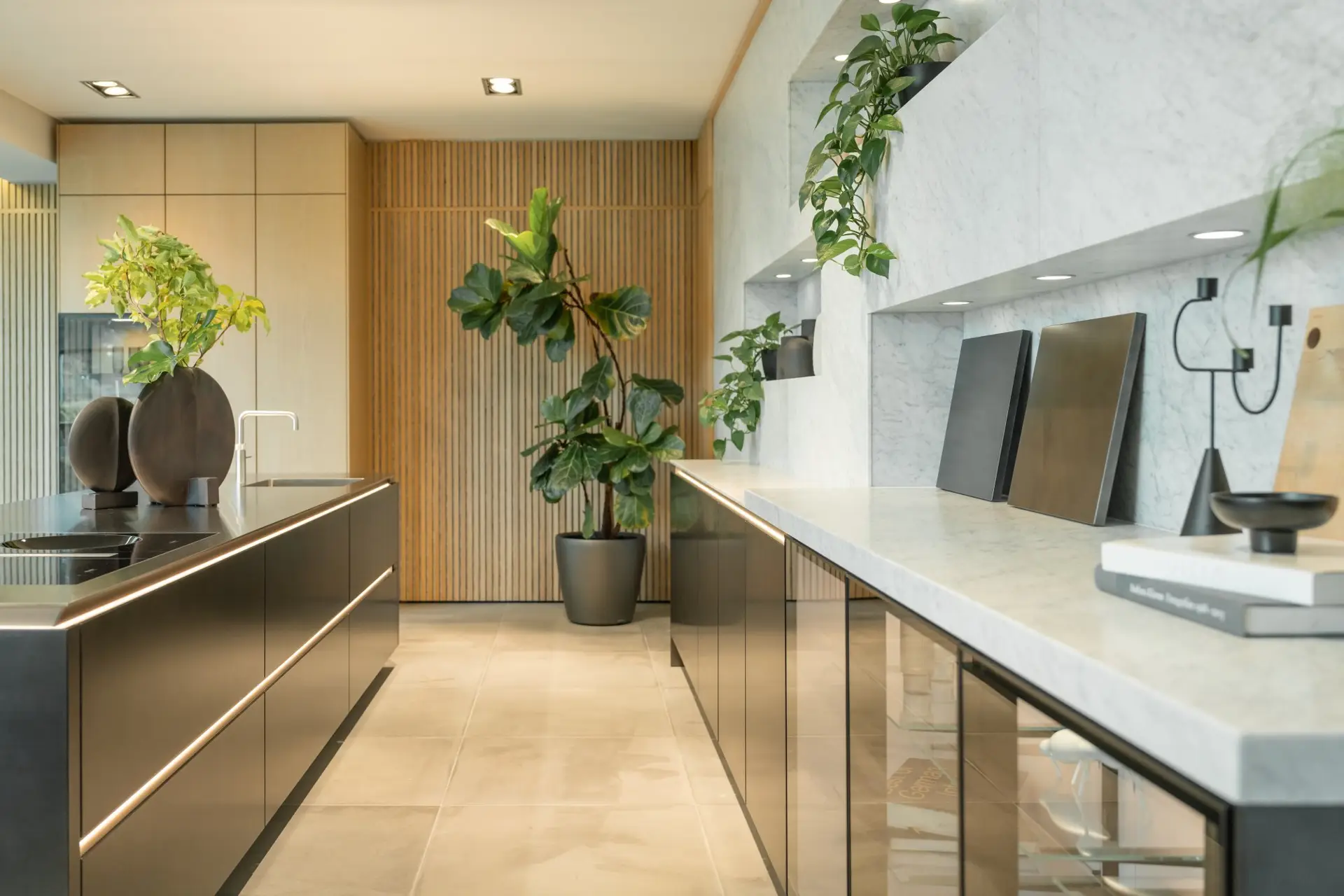 SieMatic SLX bronze kitchen run with Carrara marble and glass vitrines