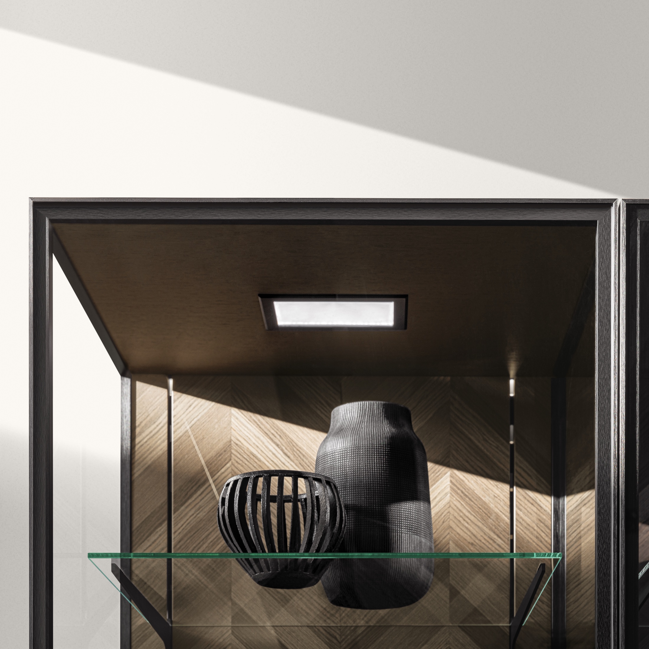 SieMatic SLX glass vitrine cabinet with chevron veneer interior