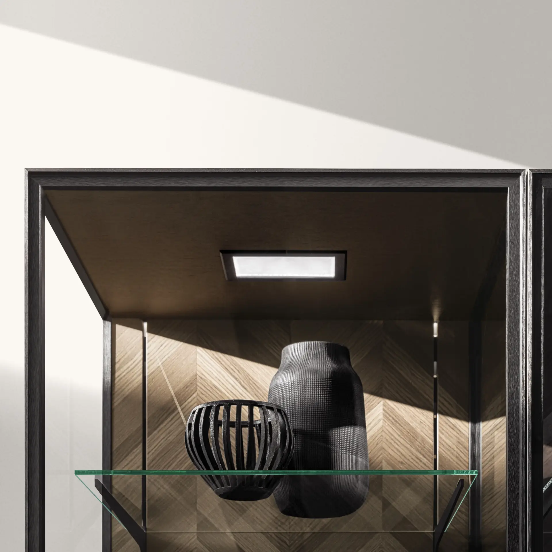 SieMatic SLX glass vitrine cabinet with chevron veneer interior