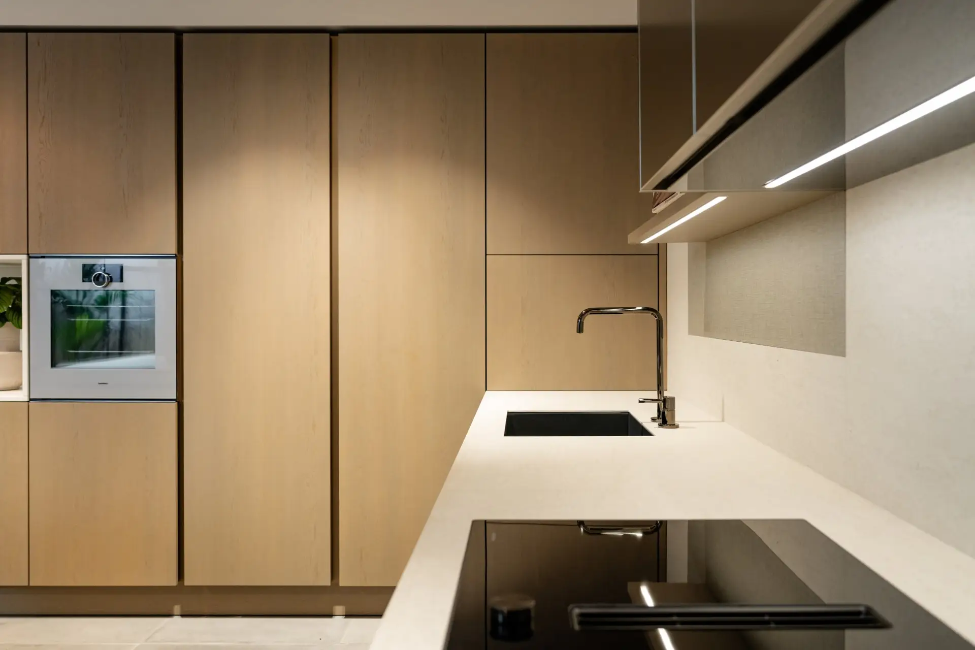 SieMatic SLX light oak tall cabinets with integrated worktop detail