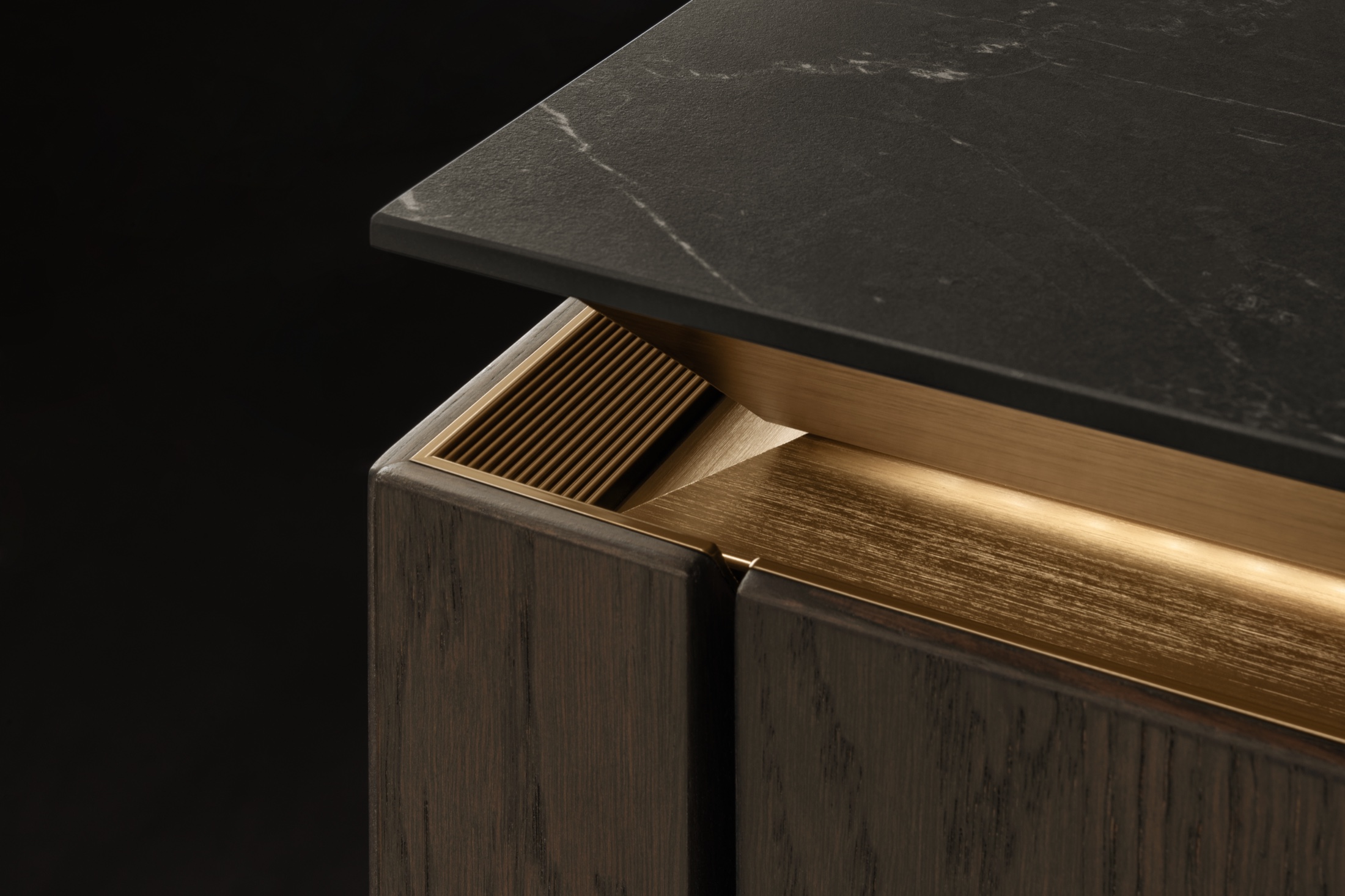 SieMatic SLX smoked oak door with gold grip channel and black marble top
