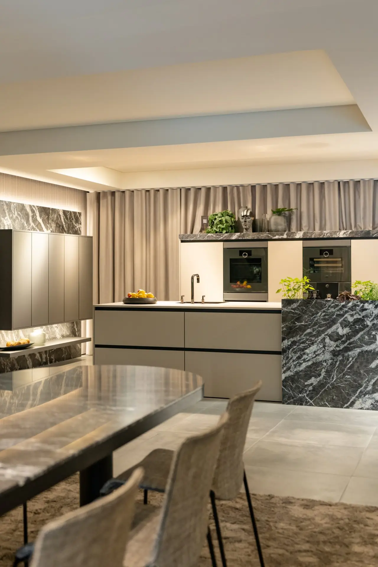 SieMatic Urban kitchen island with dining space in warm neutrals