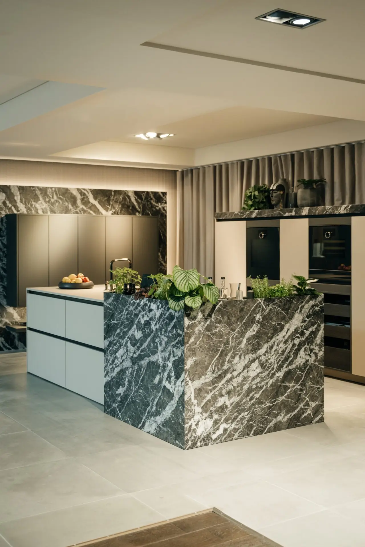 SieMatic Urban kitchen with dramatic marble waterfall island
