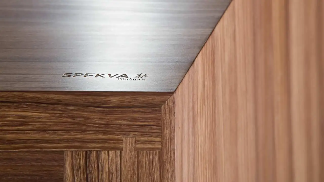 Wooden cabinetry with a Spekva worktop, showcasing luxury closet design and custom cabinetry for elegant spaces.