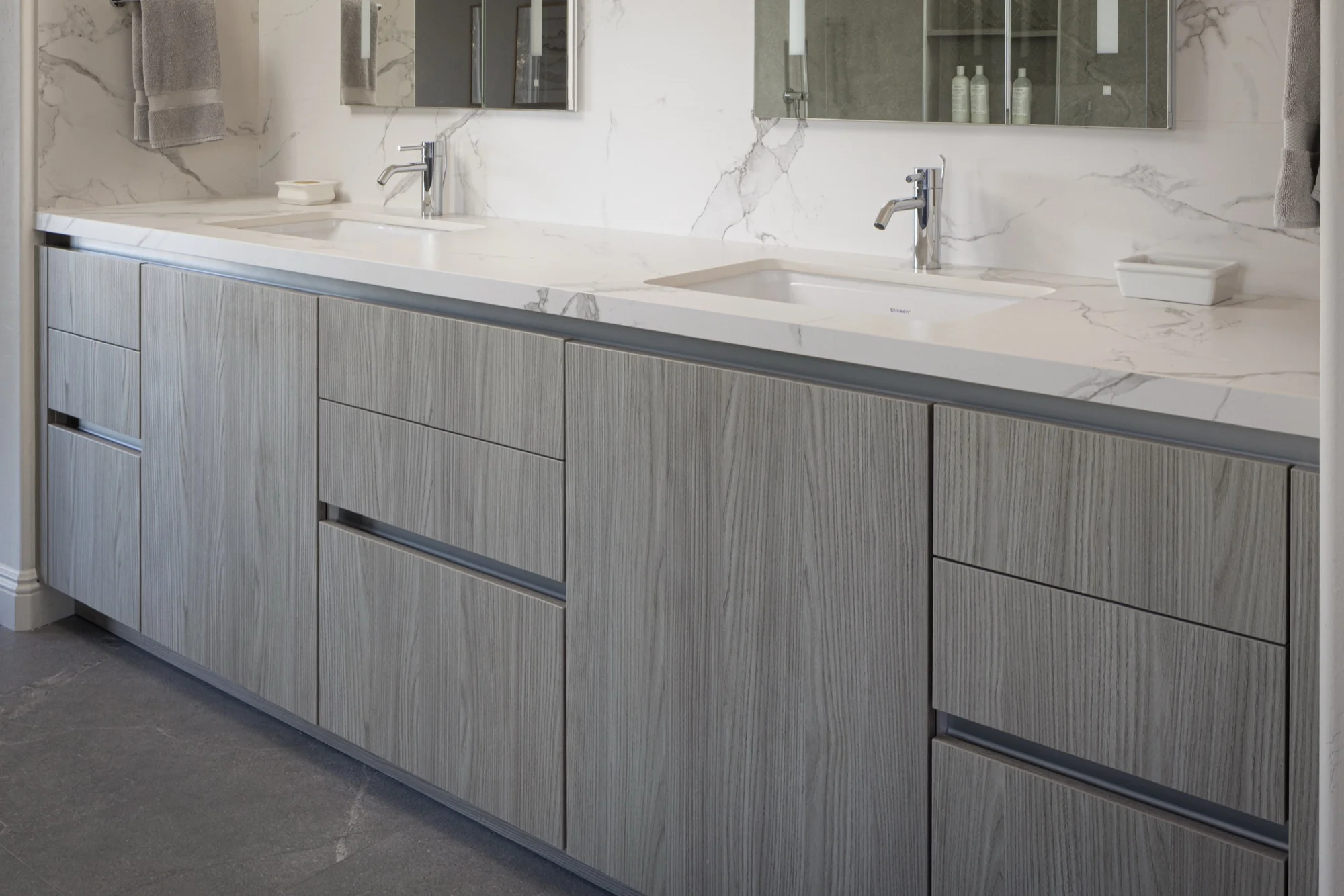 Handleless grey woodgrain vanity cabinetry detail, La Jolla bathroom by Inplace Studio