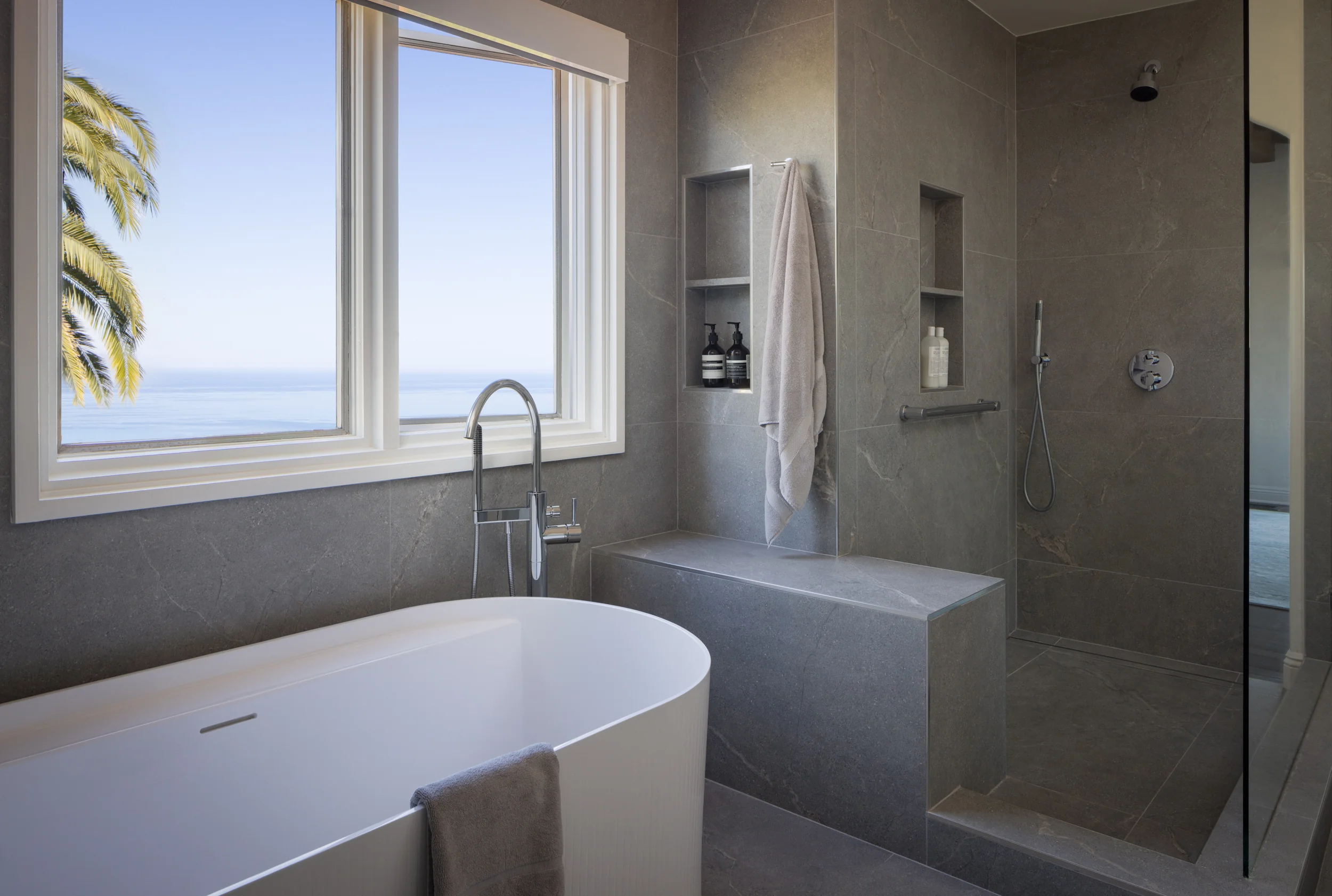 Luxury bathroom design with freestanding tub and ocean view - Inplace Studio La Jolla